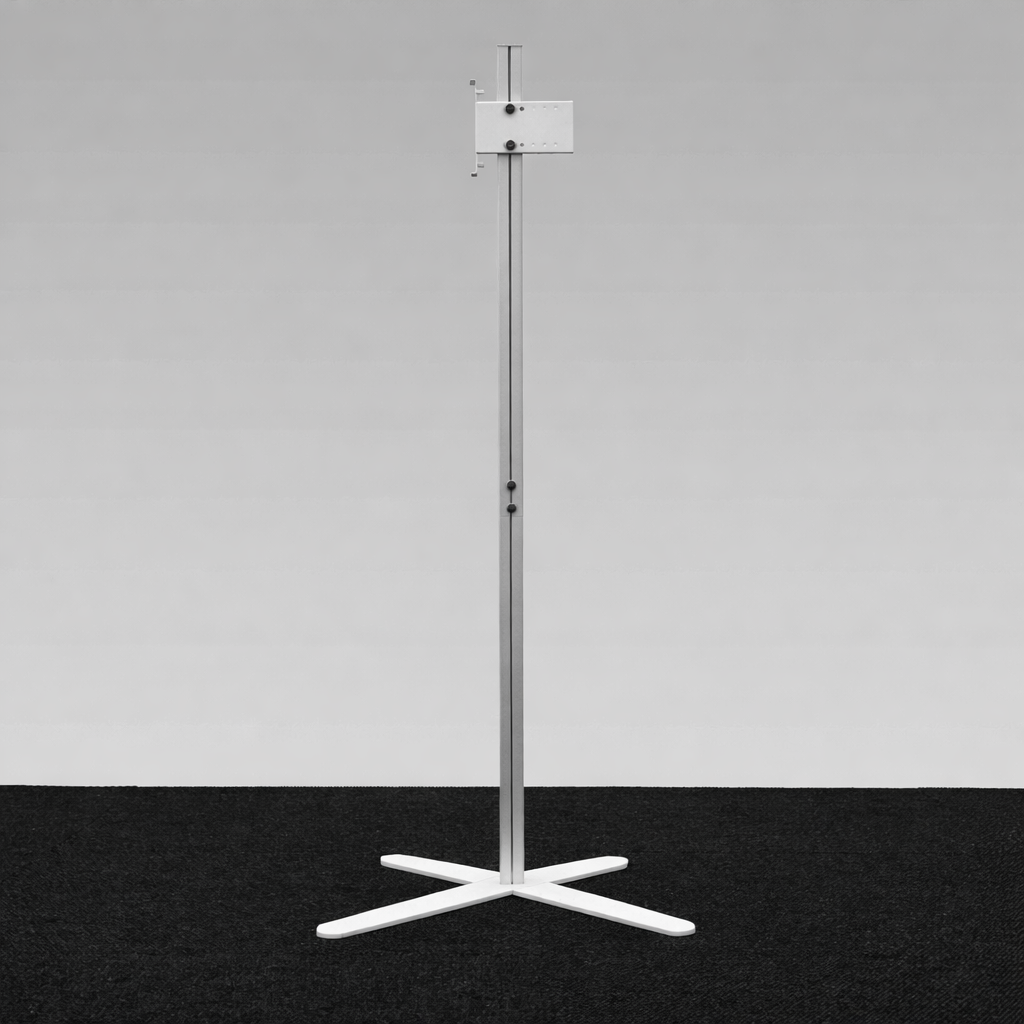 Slim 8mm steel feet of TV Stand X for discreet placement under display walls