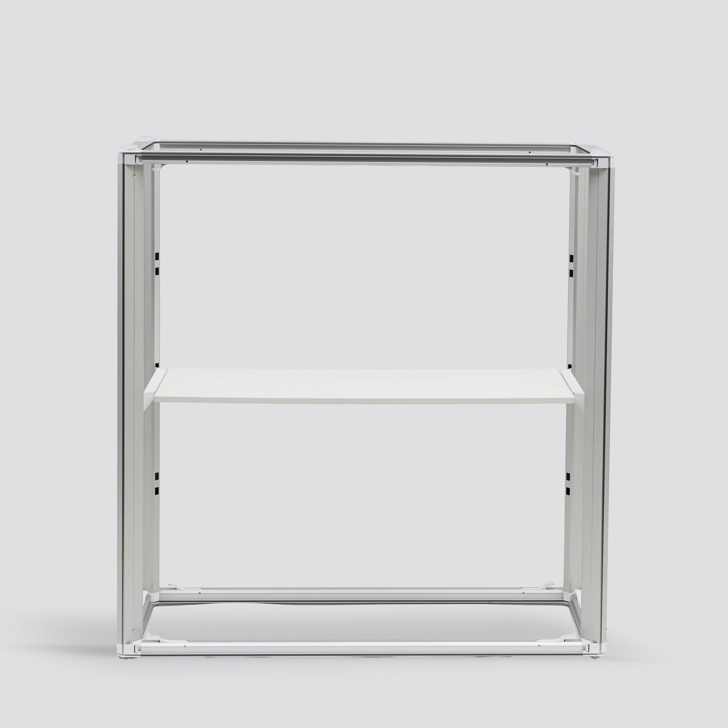 Internal view of the Qbic 40 reception counter showing the 40mm aluminum frame structure and the functional internal storage shelf