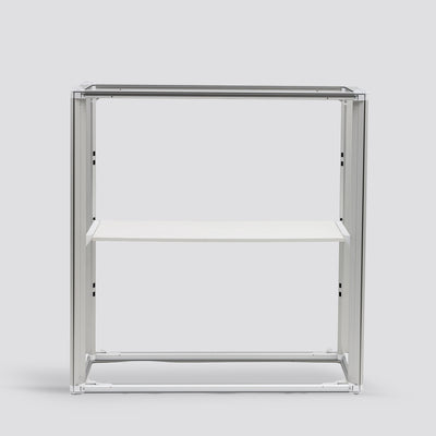 Internal view of the Qbic 40 reception counter showing the 40mm aluminum frame structure and the functional internal storage shelf