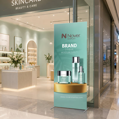 Front view of a Qseg 40 SEG banner stand with a custom fabric graphic displayed at a retail skincare store entrance.