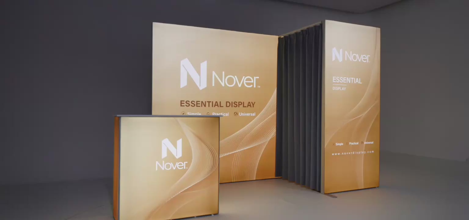 Load video: Promotional video demonstrating Nover Display collapsible trade show backdrop system, gold wave graphic panels, and matching front reception counter.